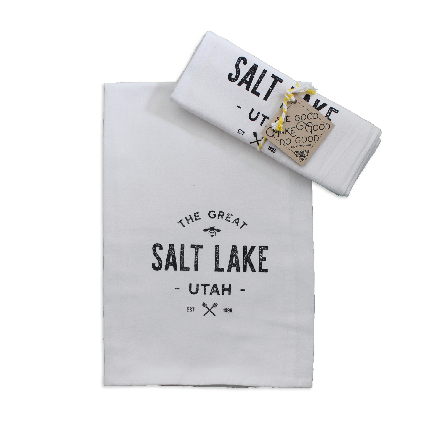 The Great Salt Lake tea towel folded as a gift and tied with a ribbon