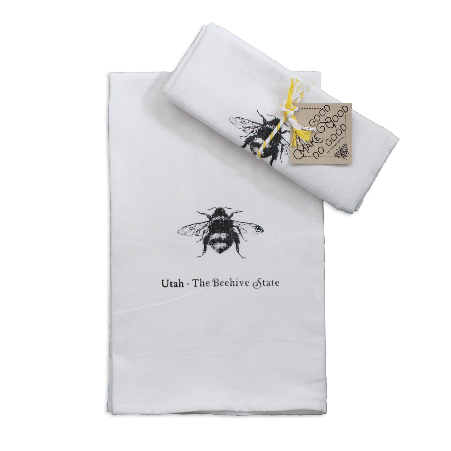 Utah the BEehive State tea towel featuring a realistic bee folded up and tied with a ribbon for a gift