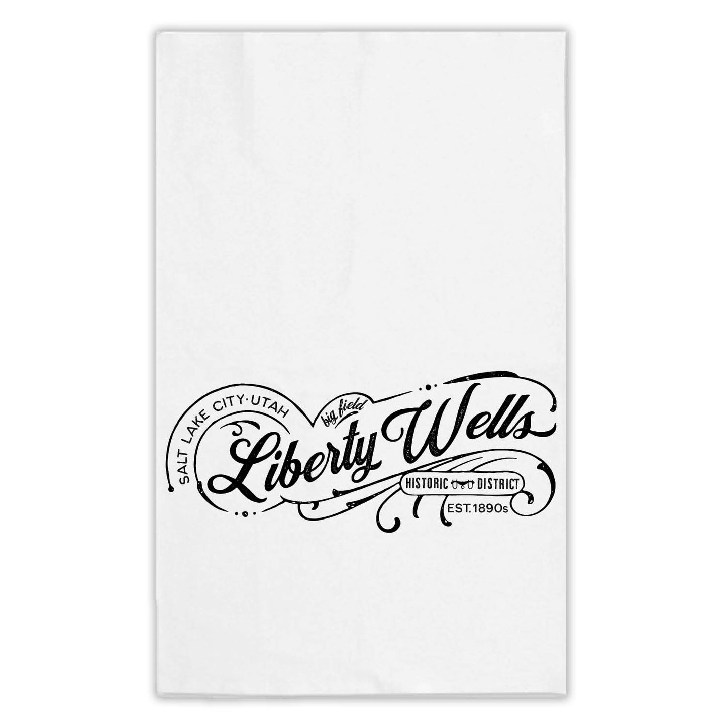 Liberty Wells Salt Lake City neighborhood swirly script design printed on a white tea towel