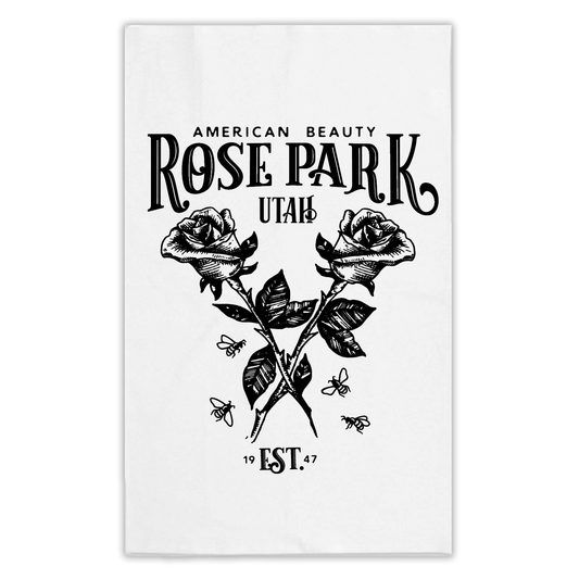 Rose Park Salt Lake City neighborhood printed on a white tea towel showing two crossed roses with bees buzzing around