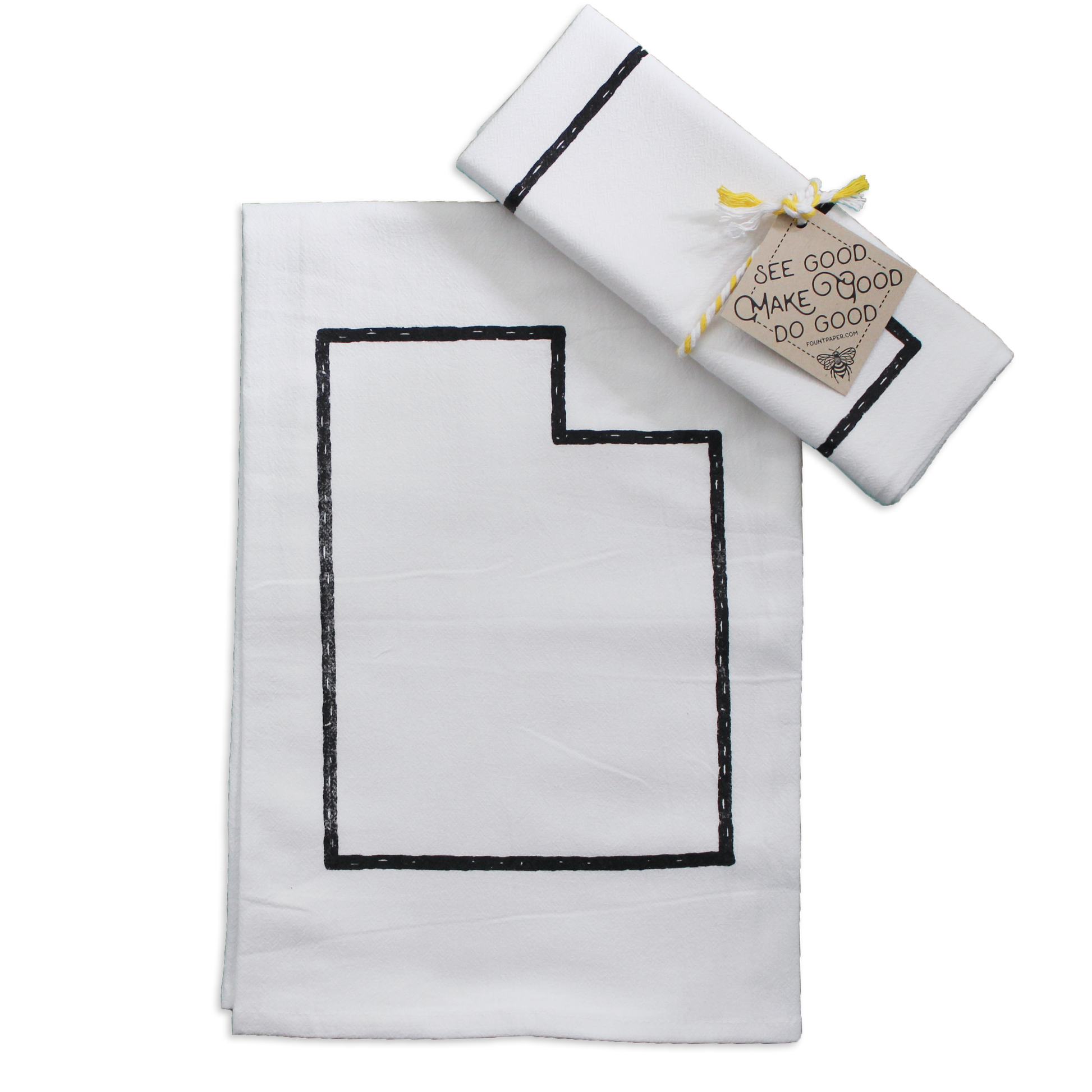 An outline of the state of utah printed in black on a kitchen tea towel Wrapped in ribbon as a gift